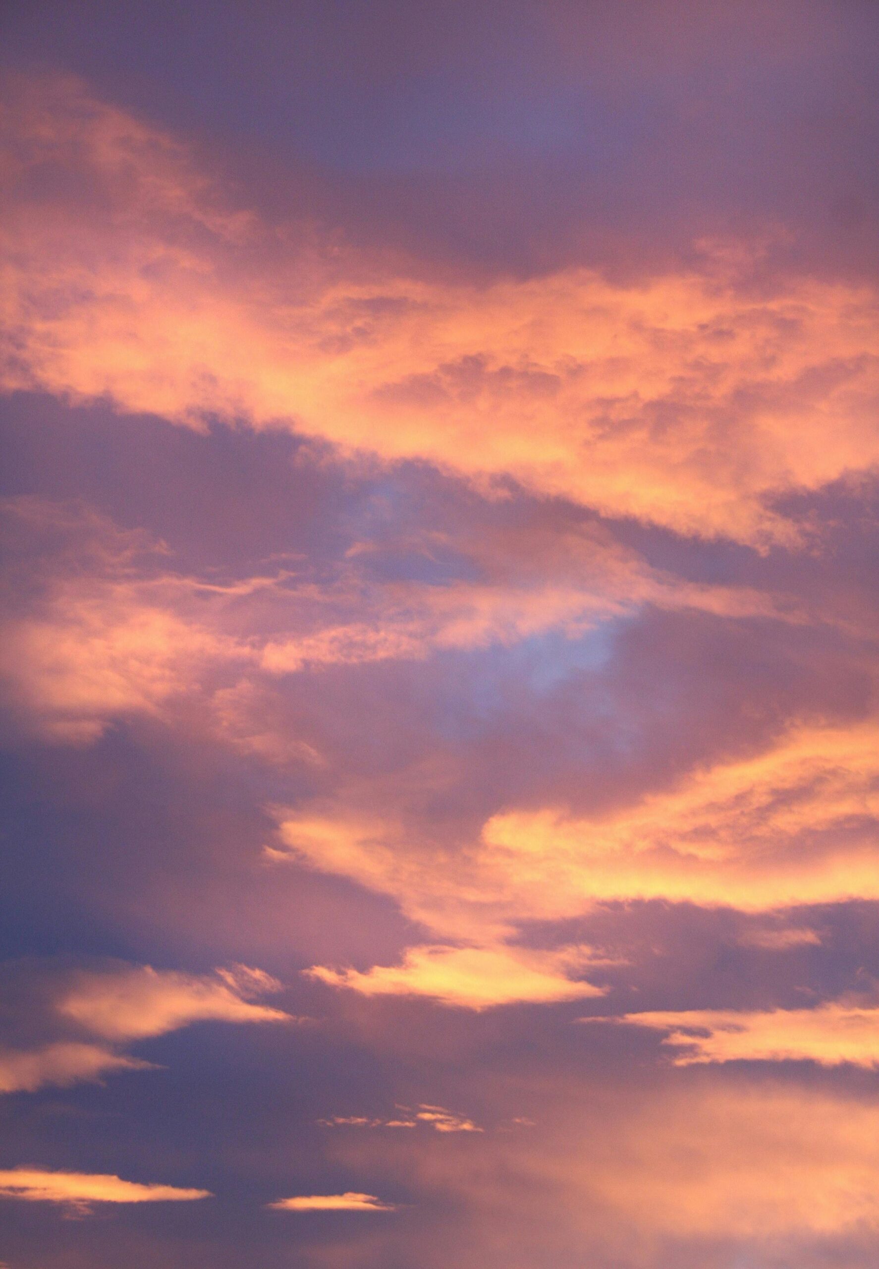 Cloudy sky in pink and orange hues